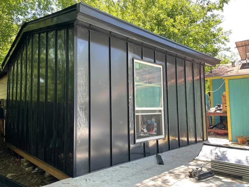 Black standing seam metal wall panels for Metal Roof Installation in Seabrook